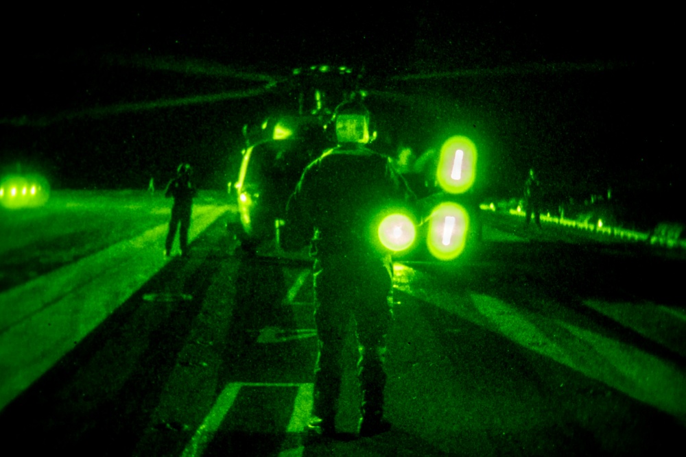 USS Theodore Roosevelt Conducts Nighttime Helicopter Operations