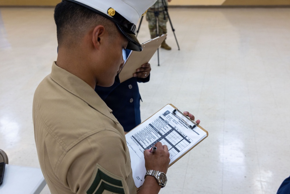 Marines volunteer for the 3rd annual JROTC drill competition