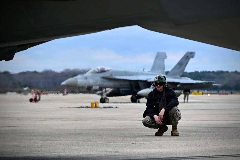 Sailor prepares an F/A-18E for takeoff