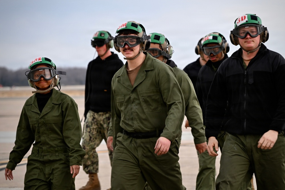 Sailors walk off NAS Oceana flight line
