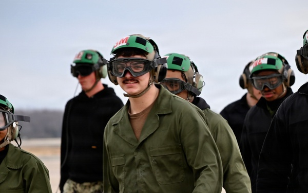 Sailors walk off NAS Oceana flight line