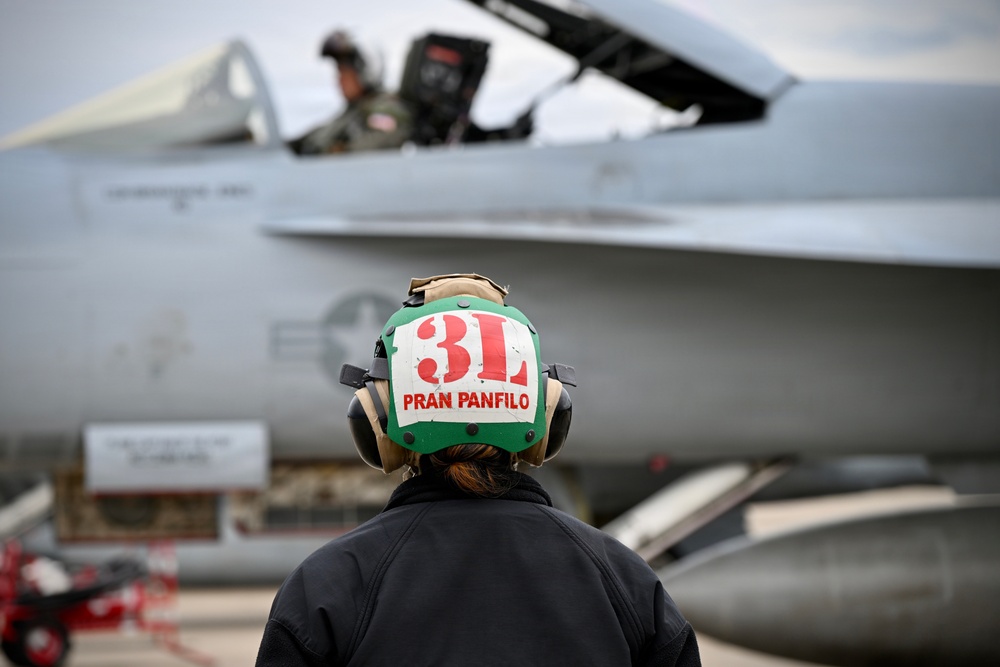 Sailor prepares an F/A-18E for takeoff at NAS Oceana