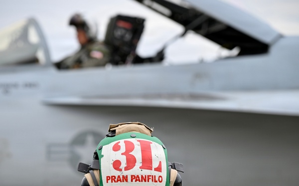 Sailor prepares an F/A-18E for takeoff at NAS Oceana