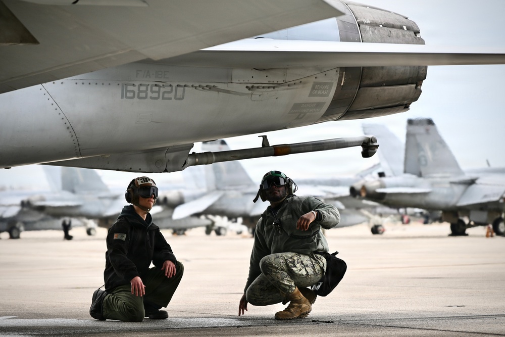 Sailors prepare an F/A-18E for takeoff at NAS Oceana