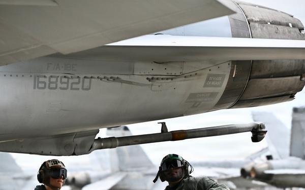 Sailors prepare an F/A-18E for takeoff at NAS Oceana