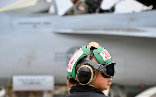 Sailor prepares an F/A-18E for takeoff at NAS Oceana