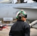 Sailor prepares an F/A-18E for takeoff at NAS Oceana