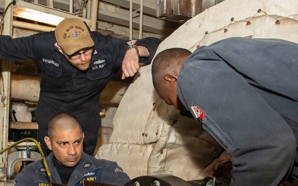 Maintenance conducted in USS Blue Ridge's engine room
