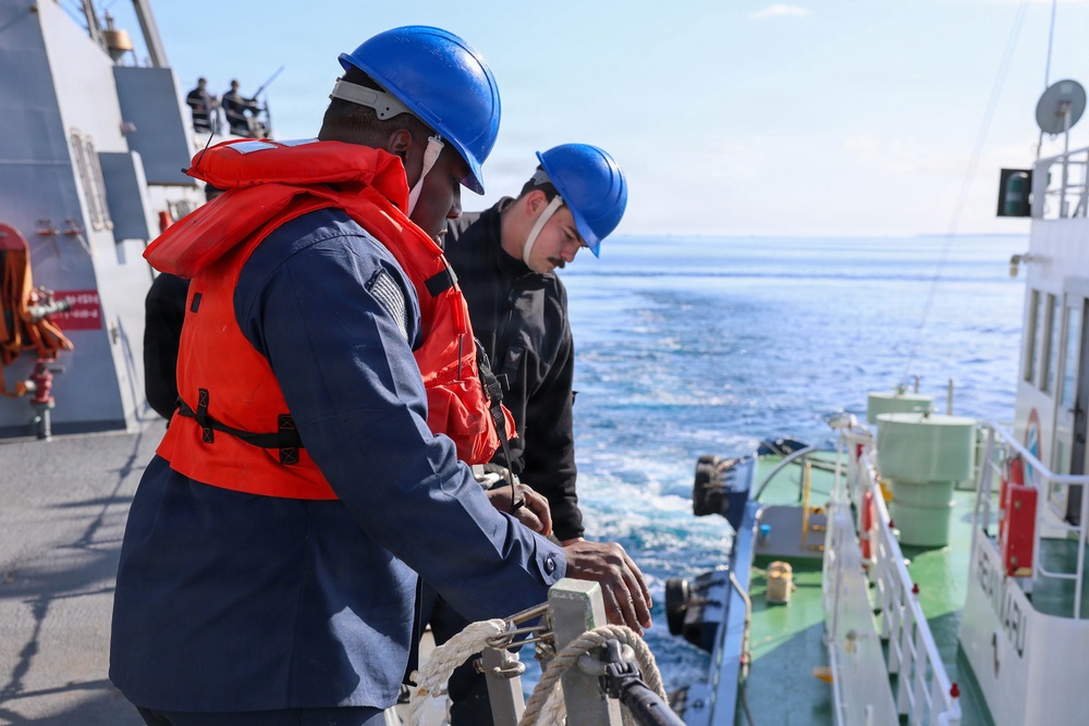 Sailors aboard the USS John Finn conduct a sea and anchor detail in Okinawa, Japan