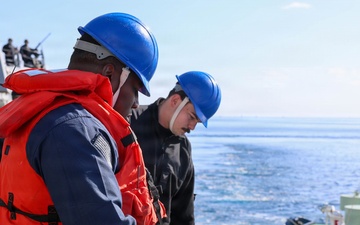 Sailors aboard the USS John Finn conduct a sea and anchor detail in Okinawa, Japan