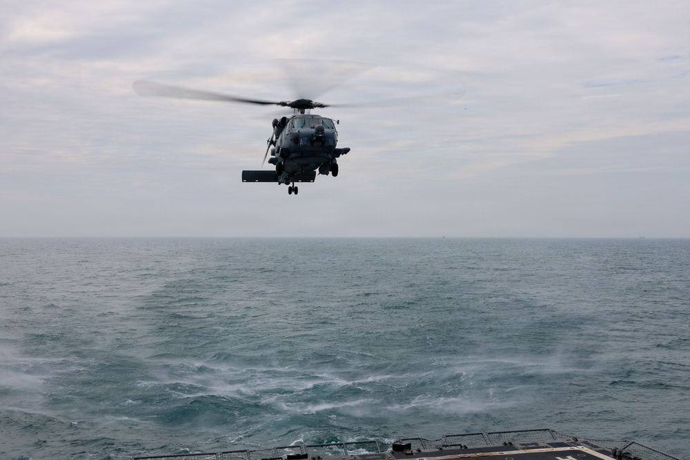 Sailors aboard the USS John Finn conduct flight quarters