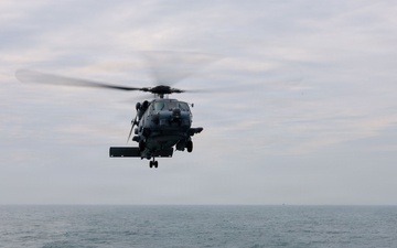 Sailors aboard the USS John Finn conduct flight quarters