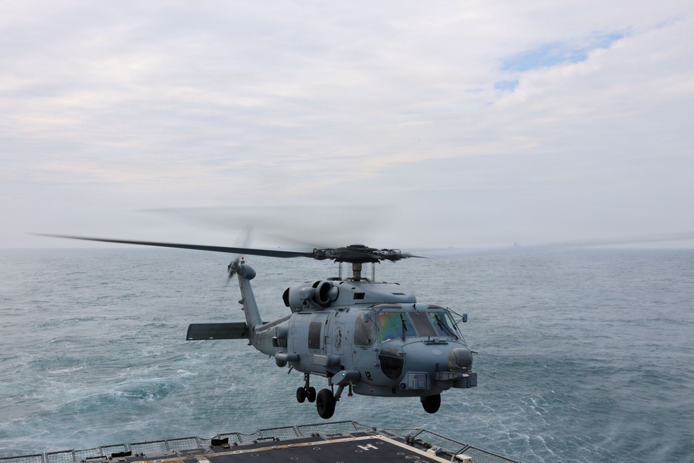 Sailors aboard the USS John Finn conduct flight quarters