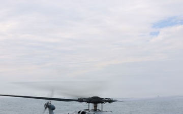 Sailors aboard the USS John Finn conduct flight quarters