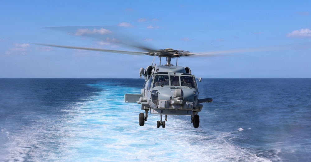 Sailors aboard the USS John Finn conduct flight quarters in the East China Sea