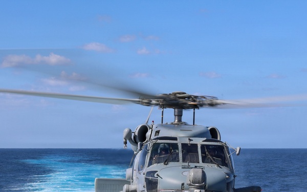 Sailors aboard the USS John Finn conduct flight quarters in the East China Sea