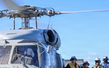 Sailors aboard the USS John Finn conduct flight quarters in the East China Sea
