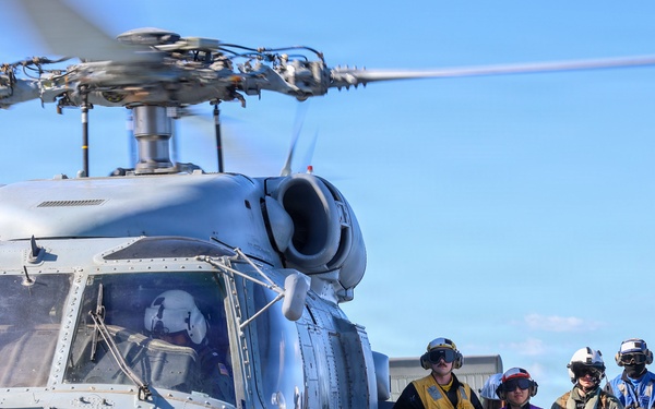 Sailors aboard the USS John Finn conduct flight quarters in the East China Sea