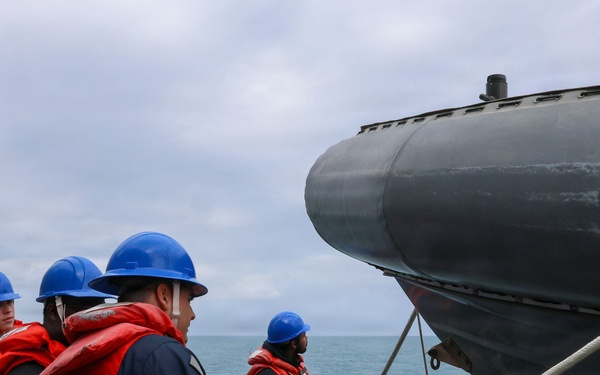 Sailors aboard the USS John Finn conduct small boat operations in the East China Sea
