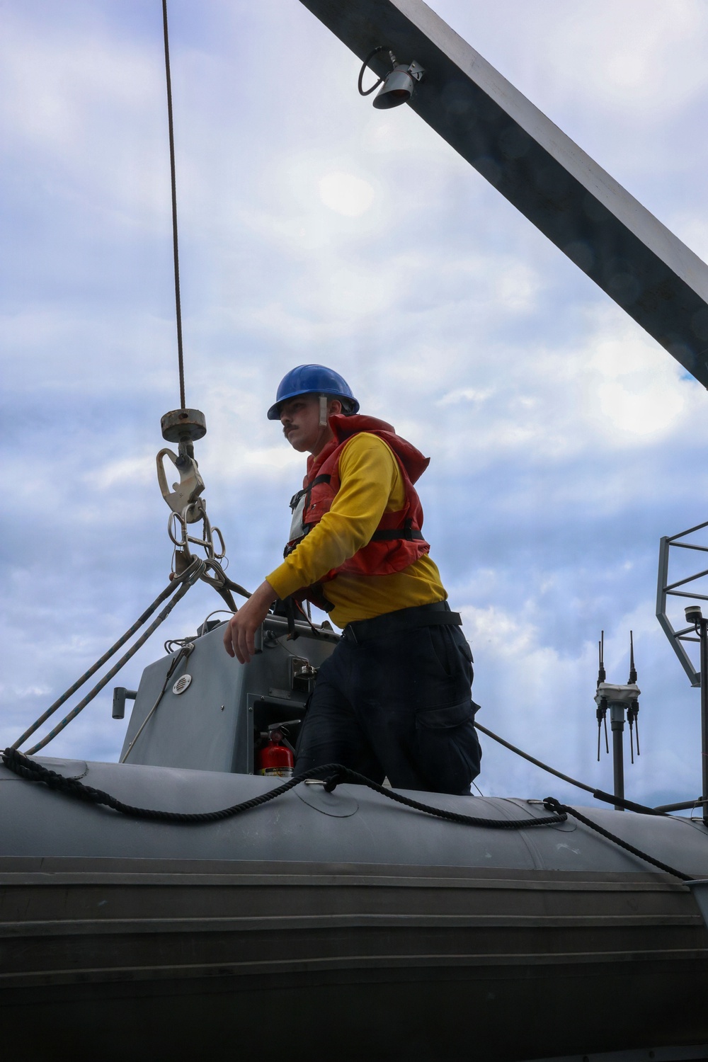 Sailors aboard the USS John Finn conduct small boat operations in the East China Sea