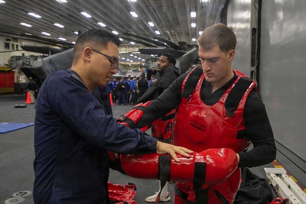 USS Tripoli Sailors Go Through the Non-Lethal Weapons Course