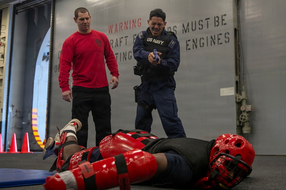 USS Tripoli Sailors Go Through the Non-Lethal Weapons Course