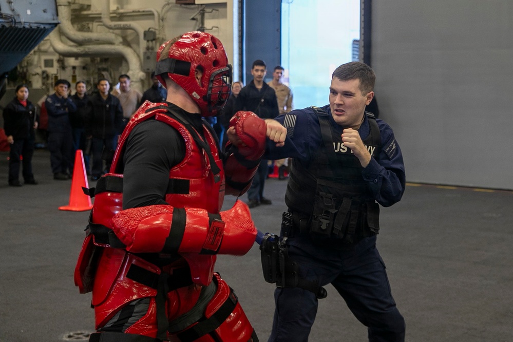 USS Tripoli Sailors Go Through the Non-Lethal Weapons Course