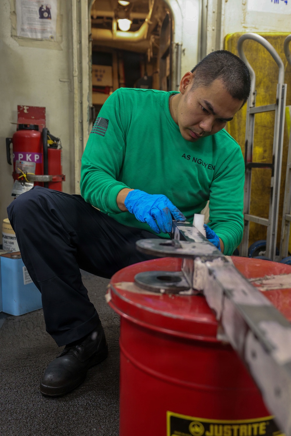 Abraham Lincoln conducts routine maintenance