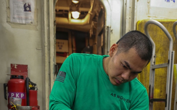 Abraham Lincoln conducts routine maintenance