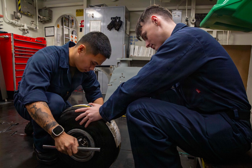 Abraham Lincoln conducts routine aircraft maintenance