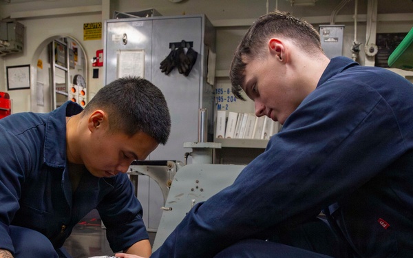 Abraham Lincoln conducts routine aircraft maintenance
