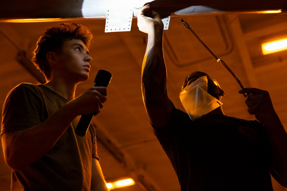 Abraham Lincoln conducts routine aircraft maintenance