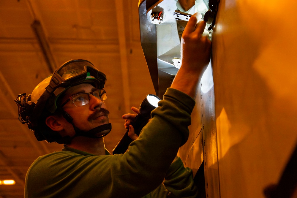 Abraham Lincoln conducts routine aircraft maintenance