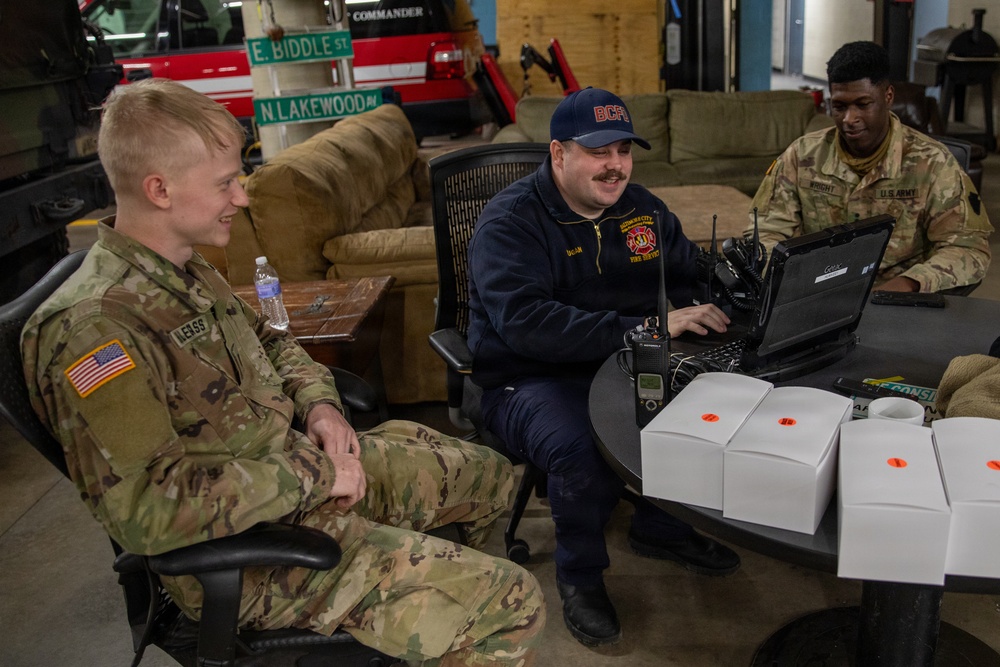 Maryland Army National Guard Cadet Deandre Wright and Spc. Nathan Hillegass and Shane Dugan, a Paramedic at Old Town Fire Station, Discuss Operation Blur