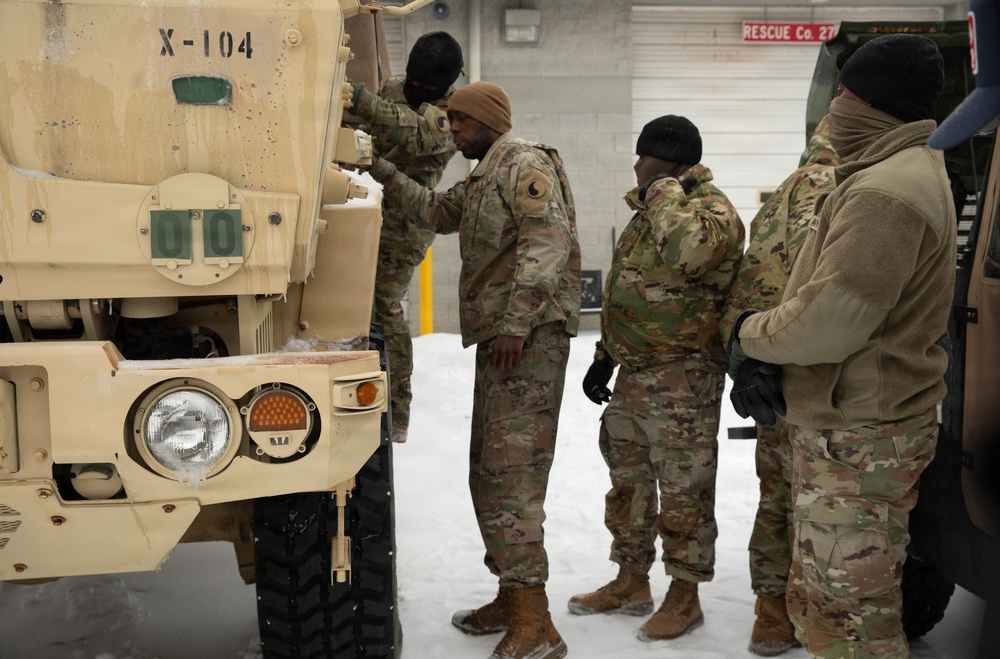 Soldiers Conduct Vehicle Maintenance in Snow