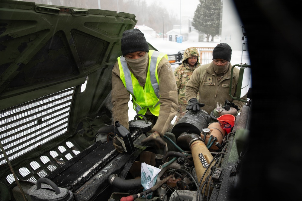 Soldiers Conduct Vehicle Maintenance in Snow