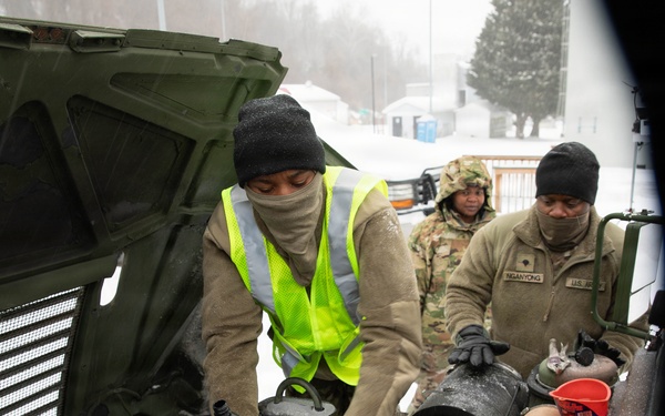 Soldiers Conduct Vehicle Maintenance in Snow