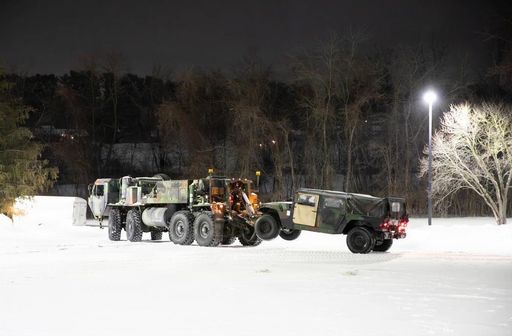 Military Vehicle Towed in Snow