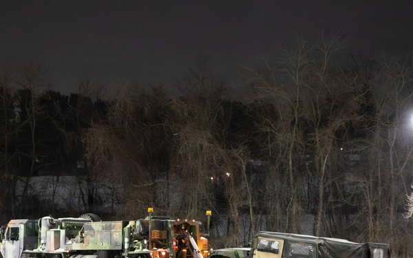 Military Vehicle Towed in Snow