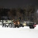 Military Vehicle Towed in Snow