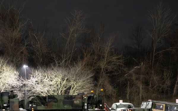 Military Vehicle Towed in Snow