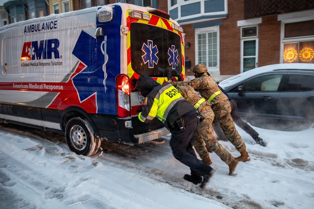Maryland Army National Guard Soldiers and Paramedics from Old Town Fire Station Push an Ambulance Out of the Snow