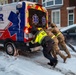 Maryland Army National Guard Soldiers and Paramedics from Old Town Fire Station Push an Ambulance Out of the Snow