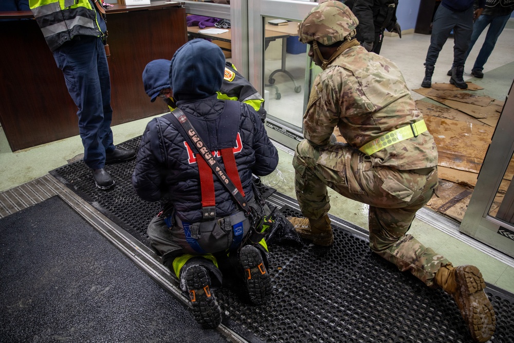 Maryland Army National Guard Cadet Deandre Wright Assists Paramedics and Firefighters from Old Town Fire Station with a Patient