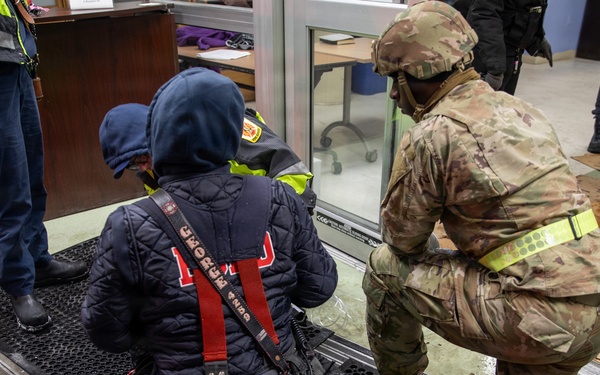 Maryland Army National Guard Cadet Deandre Wright Assists Paramedics and Firefighters from Old Town Fire Station with a Patient