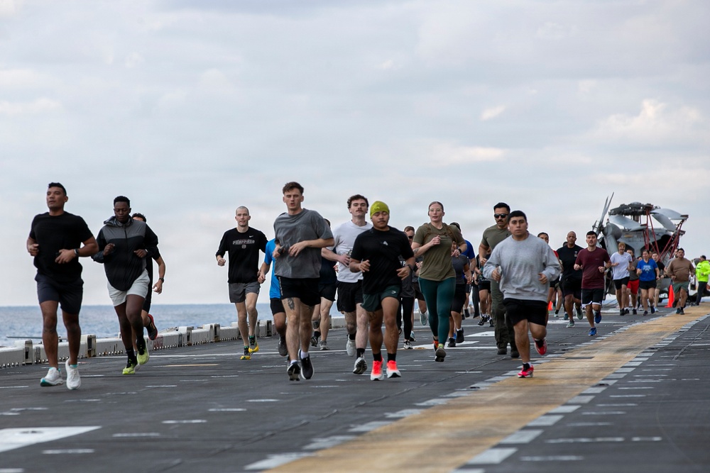 Sailors and Marines Run on the Flight Deck Aboard USS Tripoli
