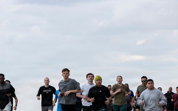 Sailors and Marines Run on the Flight Deck Aboard USS Tripoli