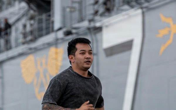Sailors and Marines Run on the Flight Deck Aboard USS Tripoli
