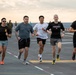 Sailors and Marines Run on the Flight Deck Aboard USS Tripoli
