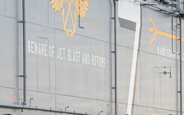 Sailors and Marines Run on the Flight Deck Aboard USS Tripoli